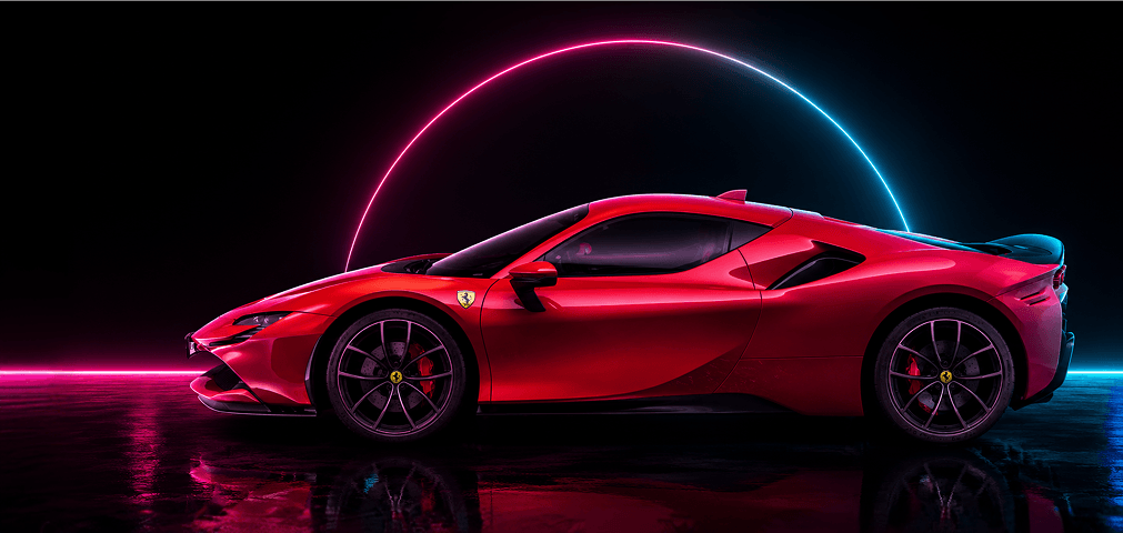 Red Ferrari sports car parked on a glossy surface in a dark studio with pink and blue neon arcs behind it.